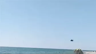 The Passage Of A Russia’s Helicopters Over A Beach Low Altitude