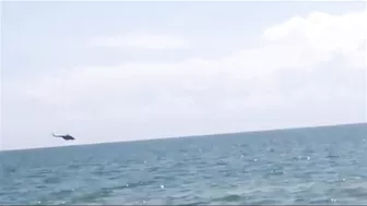 The Passage Of A Russia’s Helicopters Over A Beach Low Altitude