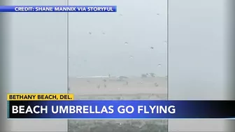 Storm sends umbrellas flying into ocean in Bethany Beach, Delaware