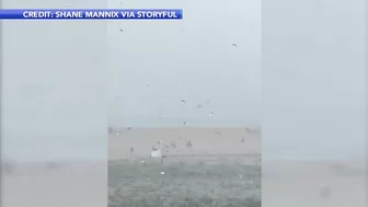 Storm sends umbrellas flying into ocean in Bethany Beach, Delaware