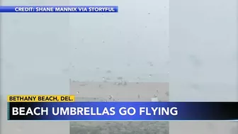 Storm sends umbrellas flying into ocean in Bethany Beach, Delaware