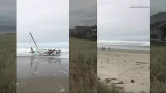 Capsized sailboat removed from shore near Rockaway Beach