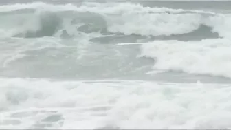 Capsized sailboat removed from shore near Rockaway Beach