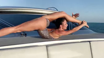 Stretching on a boat trip . Splits and back bends