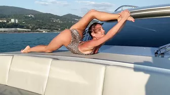 Stretching on a boat trip . Splits and back bends