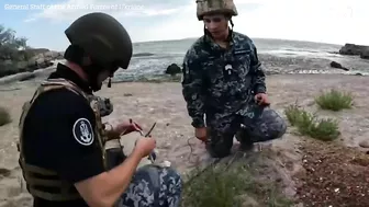 Ukrainian army destroys drifting sea mine with explosives on beach