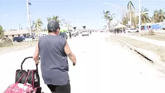 Fort Myers Beach residents leaving the island on foot