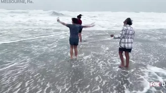 Hurricane Nicole: Weather tourists on Indialantic Beach in Melbourne, Florida