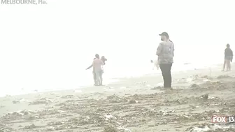 Hurricane Nicole: Weather tourists on Indialantic Beach in Melbourne, Florida