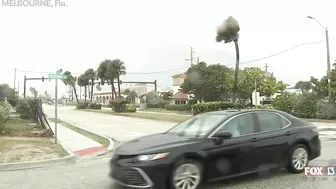 Hurricane Nicole: Weather tourists on Indialantic Beach in Melbourne, Florida