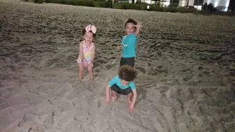 the beach with family and TRIPLETS