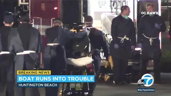 Suspected smuggling boat washes ashore with 12 aboard in Huntington Beach