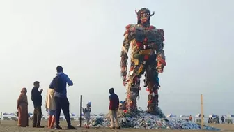 Giant Plastic Garbage Monster Looms Over Beach