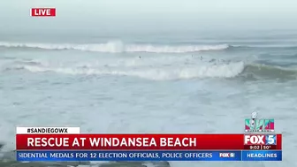 Lifeguards Rescue Surfers At Windansea Beach