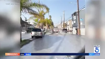 Video: Huntington Beach bicyclist swamped by spray from CalTrans truck