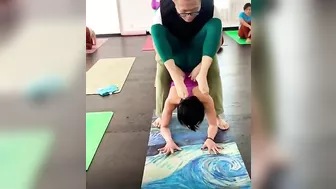 Yoga trainer helping girl in exercise for her flexible body #yoga #exercise #workout #gym #trainer