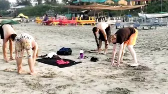 Foreigners practice Yoga at Yoga Village on Arambol beach!