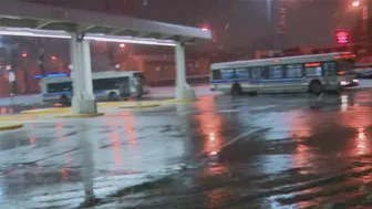 Commuters continuing routine travel as snow falls across Chicago