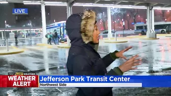 Commuters continuing routine travel as snow falls across Chicago