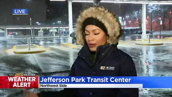 Commuters continuing routine travel as snow falls across Chicago