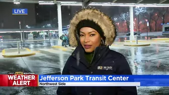 Commuters continuing routine travel as snow falls across Chicago