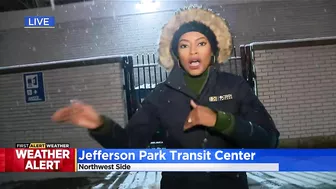 Commuters continuing routine travel as snow falls across Chicago