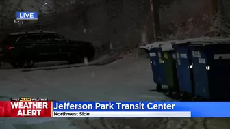 Commuters continuing routine travel as snow falls across Chicago