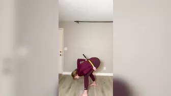 Flexible Lady Fits through a Tennis Racket