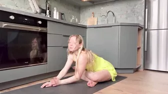 Home workout and stretching in the kitchen in dress 7