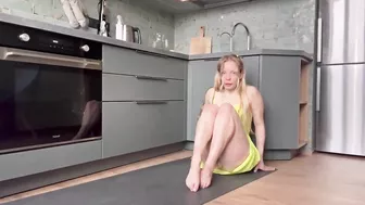 Home workout and stretching in the kitchen in dress 7