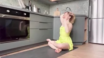 Home workout and stretching in the kitchen in dress 7