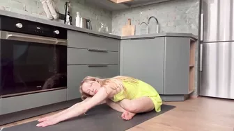 Home workout and stretching in the kitchen in dress 7