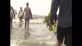 Surfers gather on Folly Beach to honor late bride