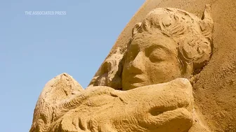 Fairy tale sand sculptures emerge from Danish beach