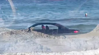 BMW washed out to sea on Cornish beach rescued by coastguard