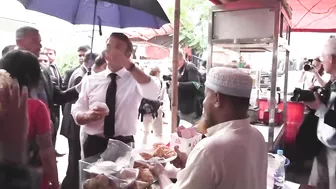 France's Macron samples local food in Bangladesh, takes boat trip | AFP