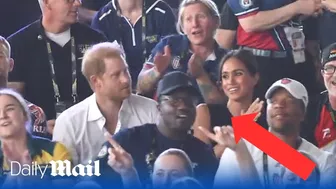 Meghan Markle sings along to Sweet Caroline - while Harry claps out of time at the Invictus Games