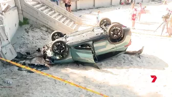 Sydney family moments from disaster as car flips onto Balmoral Beach | 7 News Australia