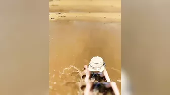 babies facing water waves on the beach ⛱️