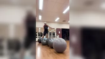 Man Hops From One Yoga Ball to Another - 1408462-6