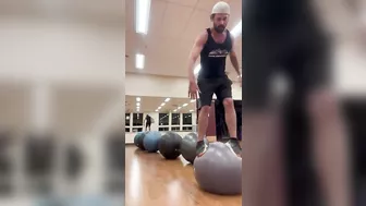 Man Hops From One Yoga Ball to Another - 1408462-6