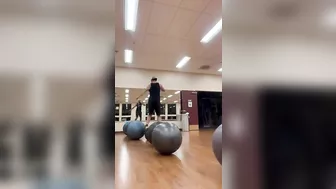 Man Hops From One Yoga Ball to Another - 1408462-6