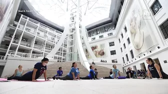 Yoga enthusiasts participate in yoga session at National Museum of Natural History