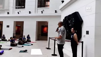 Yoga enthusiasts participate in yoga session at National Museum of Natural History