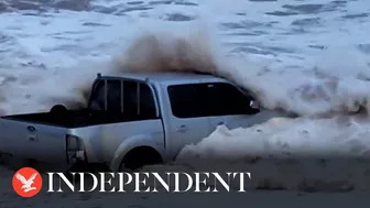 Sea spits mangled 4x4 truck out onto Devon beach following Storm Ciarán