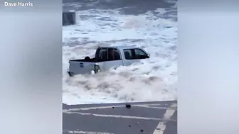 Sea spits mangled 4x4 truck out onto Devon beach following Storm Ciarán