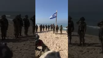 As really soldiers raise the flag on a beach in Gaza #israel