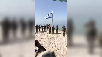 As really soldiers raise the flag on a beach in Gaza #israel