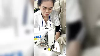 She's sewing Jackets in Garment Factory