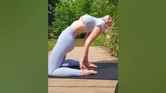 yoga backbend at the lake